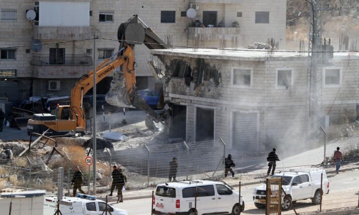 Israeli occupation demolishes a Palestinian building in the occupied Jerusalem