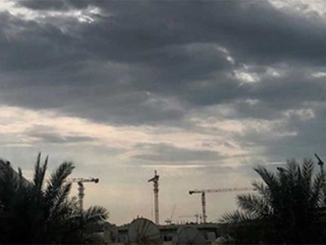 cloudy rainy skies with a significant drop in temperature